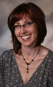 Woman smiling with her new white teeth